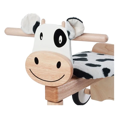 Ich bin eine Spielzeug-Laufrad-Kuh