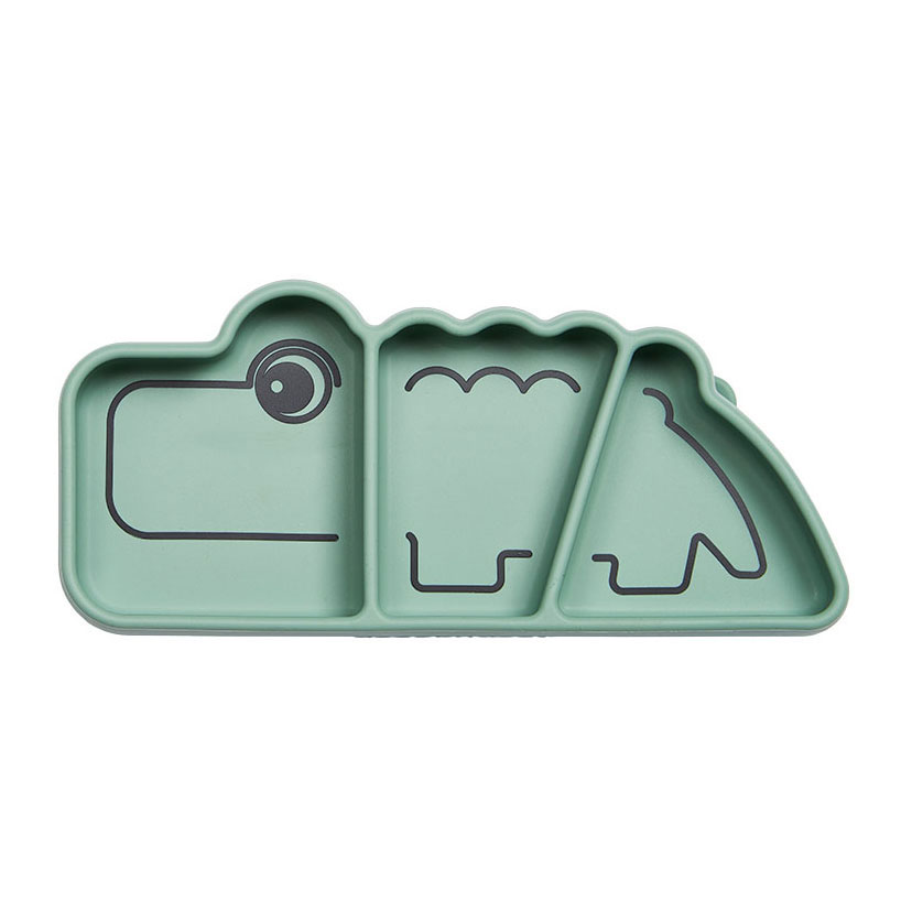 Assiette à goûter Croco en silicone vert, fabriquée par Deer.